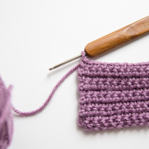 Crochet needle with yarn.